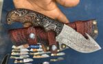 Damascus steel gut hook skinner knife with engraved wood handle